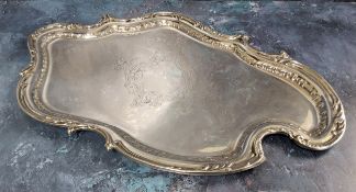 A silver cartouche shaped tray, scroll border, plain field, chased & engraved scroll & foliate
