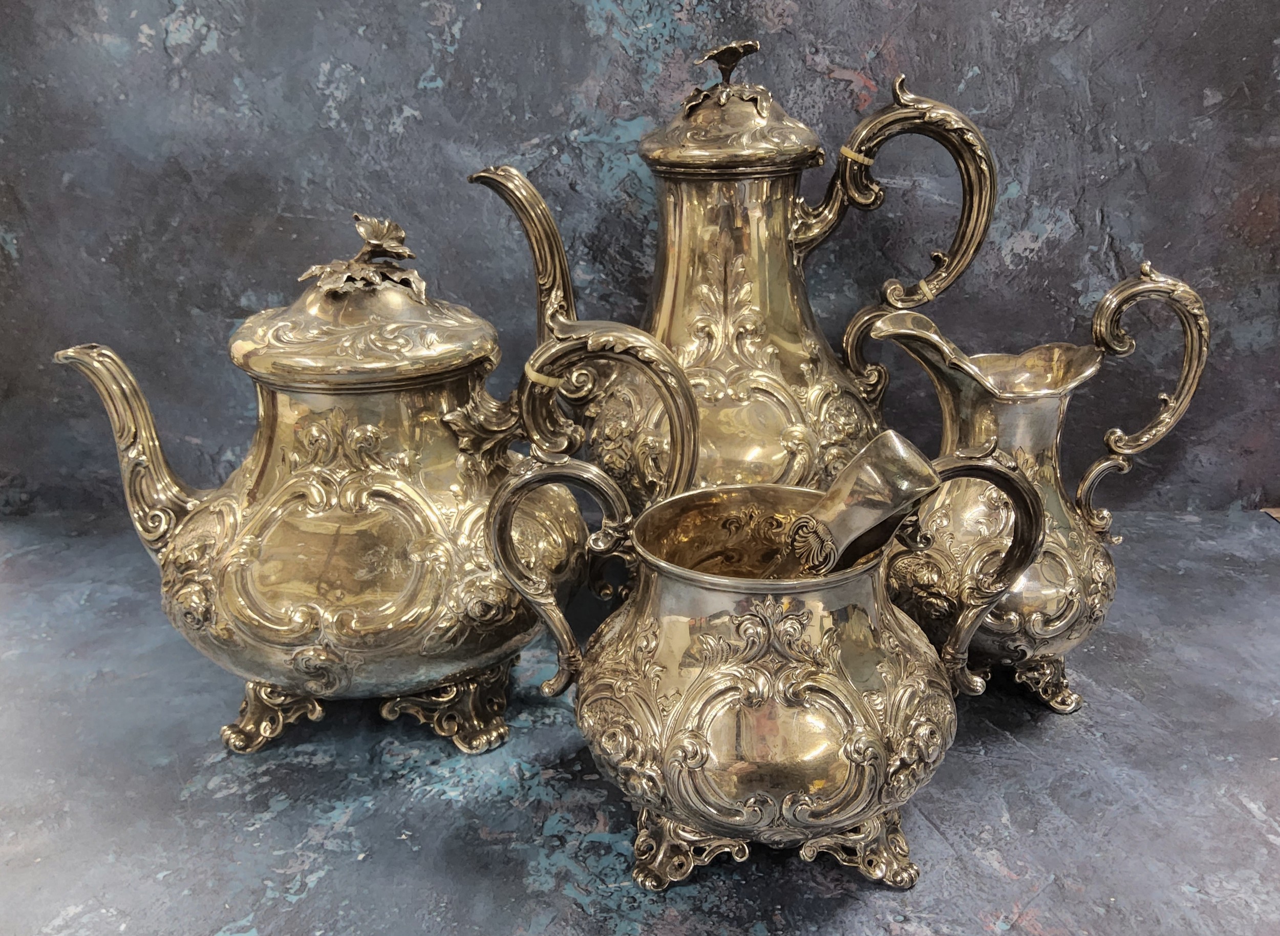 A four piece Victorian silver tea service, 1872 (coffee pot), 1871 (teapot), sugar (1929) A. Pitson,