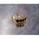 A 9ct gold five stone Garnet ring, size P, 3.67g gross