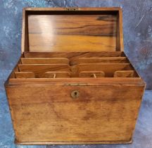 A Victorian walnut stationery box, hinged cover, enclosing stationery divisions, 30cm wide, c.1870