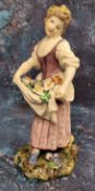 A Bristol figure,  of a girl holding flowers in her apron, in colours, 20cm high, c.1775