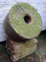 A Derbyshire gritstone millstone engraved 'HS' to one side, the othero 'Malc's Den'; a dressed solid