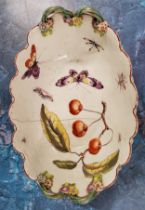 An early 18th century Derby basket, painted with cherries and moths, the exterior with basket