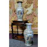 A pair of Canton Famille Rose vases, polychrome decorated with a border of chrysanthemums, roses,