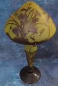 A large modern cameo glass table lamp, in the manner of Galle, decorated with flowers and foliage on
