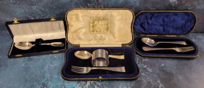 A composed silver three piece christening set, Sheffield 1944, the napkin ring, Birmingham 1946; a