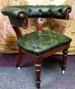 An early Victorian mahogany and club house green cockfighting chair, deep button backed back rest,