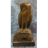 English School, 20th century, brown patinated bronzed, Owl, on a rock, rectangular base, 34cm high