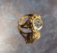 An unsual yellow metal aquamarine & diamond ring, the collet set emrald cut aquamarine, 12 x 10mm,