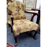 A George II style mahogany elbow chair, stuffed-over back and seat, cabriole legs, shells to