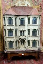 A large and impressive Lines Brothers double bay fronted dolls house, c.1895,  papered red brick