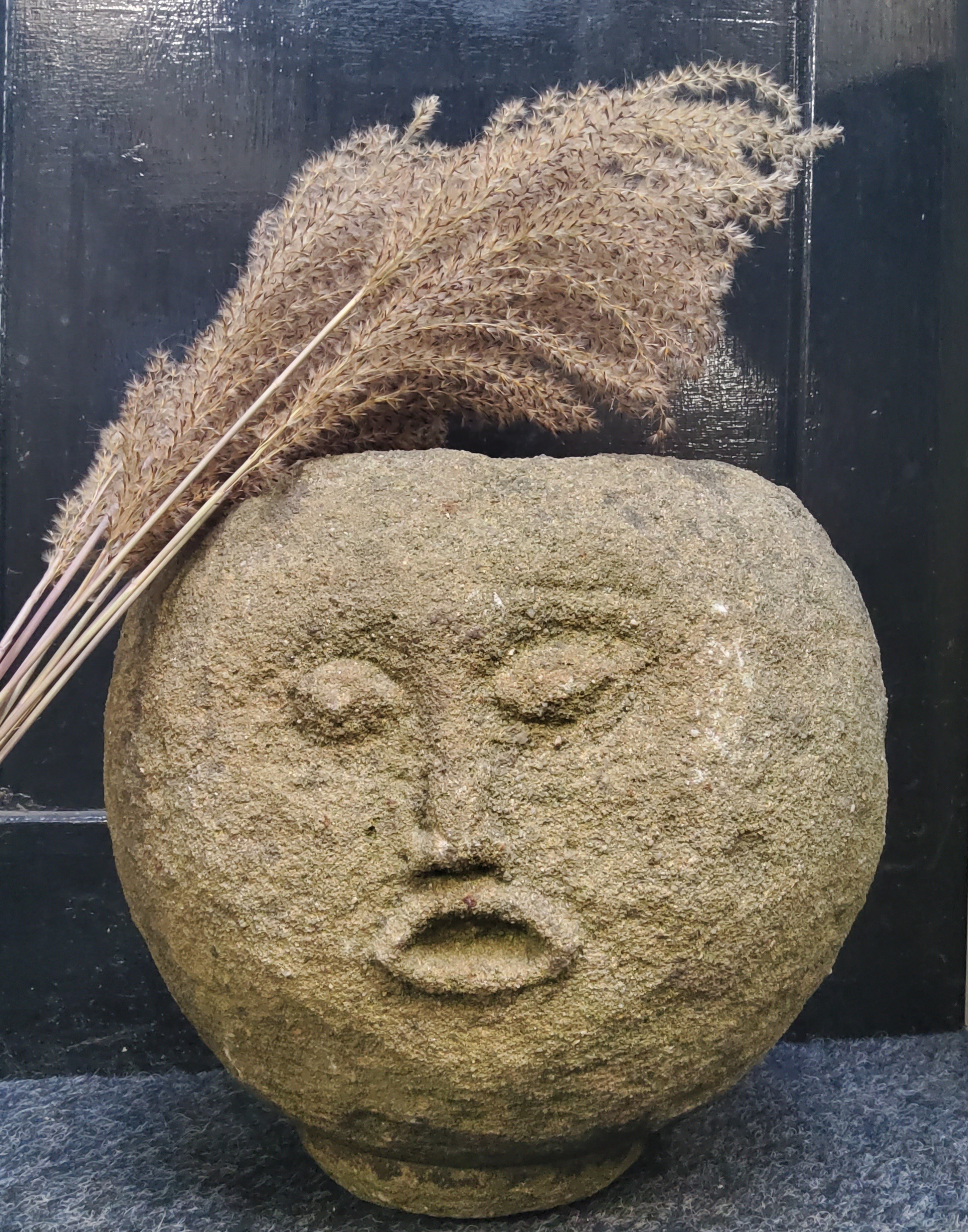 An unusual Derbyshire gritstone spherical trough, carved with a face, 33cm diameter x 30cm high - Image 2 of 5