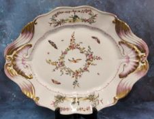 A large Sevres style shaped oval serving plate, decorated with flowers, birds and butterflies, shell