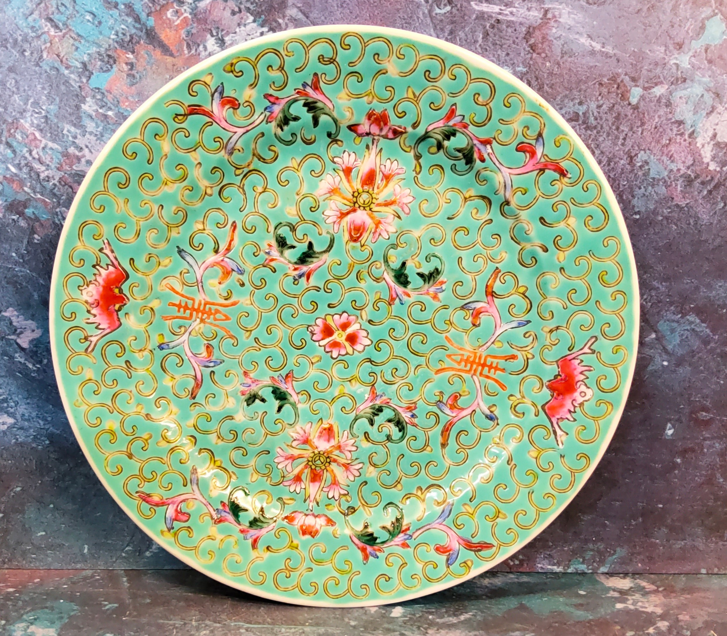 A Cantonese circular side plate, decorated with stylised flowerheads on a turquoise ground, 18cm