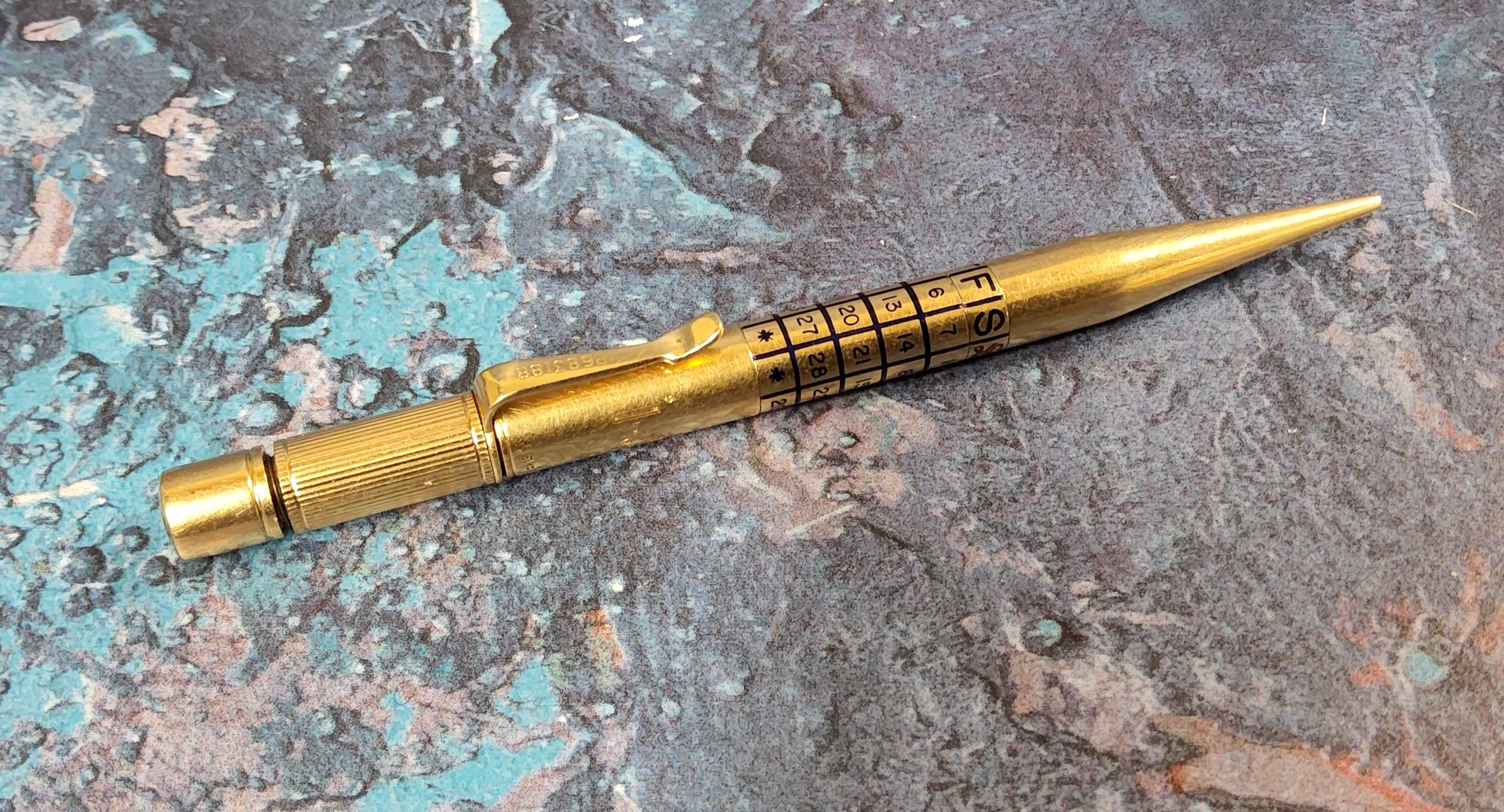 A 18ct gold calendar propelling pencil, a section of the barrel having a perpetual calendar, - Image 2 of 2