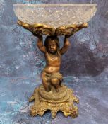 A 19th century bronze and glass figural table centrepiece, clear glass bowl supported by a scantilly