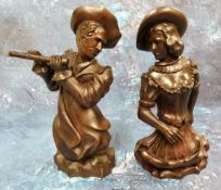 A pair of 19th century German hardwood carvings, of a musician and dancer, half length, 19.5cm high,