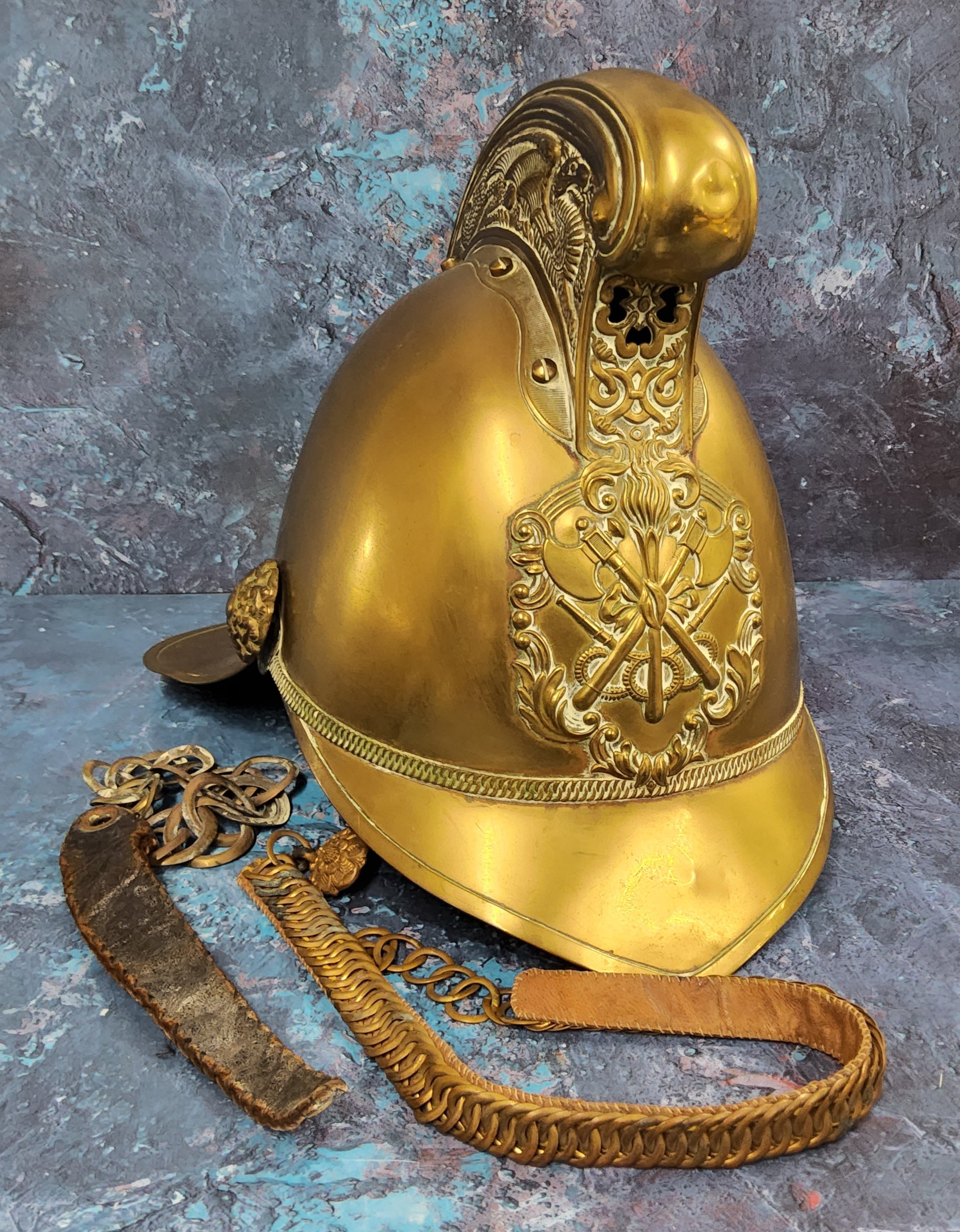 A Victorian brass Merryweather fireman's helmet, ornate high comb, applied with emblem, leather - Image 2 of 3