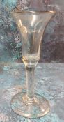 An 18th century English wine glass, flared bowl, clear stem, folded foot, 16cm high, c.1740