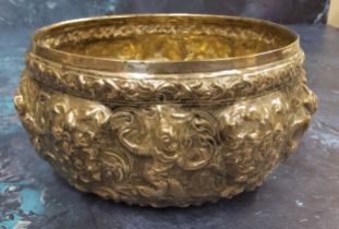 A Burmese white metal bowl, embossed overall with figures and scrolls, 15cm wide, 7.37toz