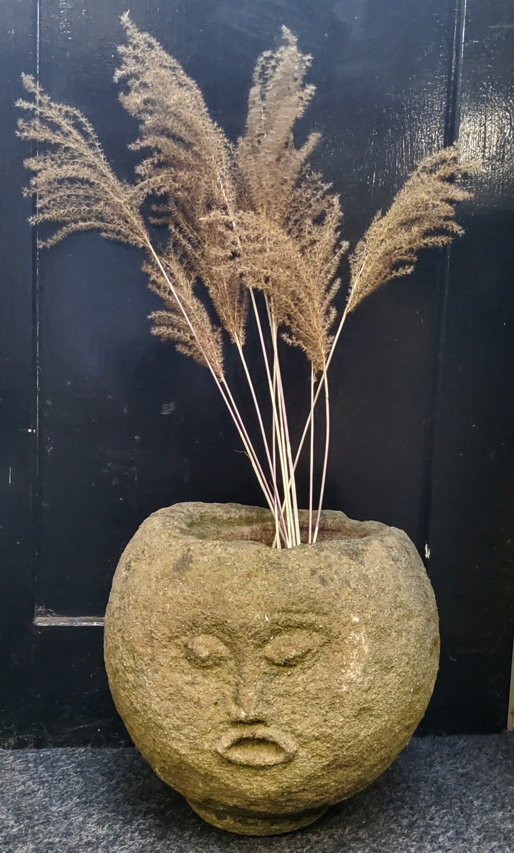 An unusual Derbyshire gritstone spherical trough, carved with a face, 33cm diameter x 30cm high - Image 4 of 5