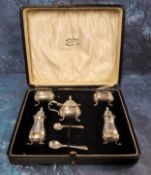 A Georg V silver five piece cruet set, of baluster form, pad feet, comprising two pepper pots. two