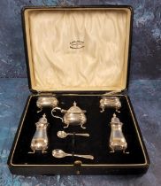 A Georg V silver five piece cruet set, of baluster form, pad feet, comprising two pepper pots. two