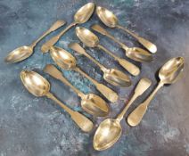 Eleven matching Scottish silver fiddle back serving spoons, each monogrammed JC, William & Patrick