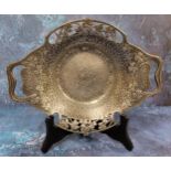 An Art Nouveau 'Tudric' pewter two handled dish, hammered, pierced and in relief with clover, 28.5cm