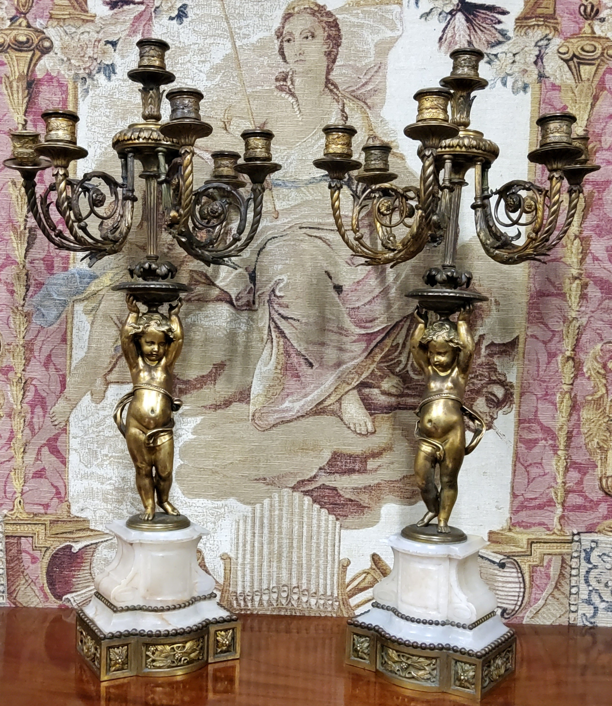 A good pair of 19th century gilt bronze and alabaster five branch, six light candelabras, the ornate