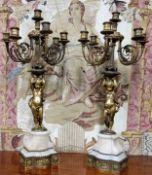 A good pair of 19th century gilt bronze and alabaster five branch, six light candelabras, the ornate