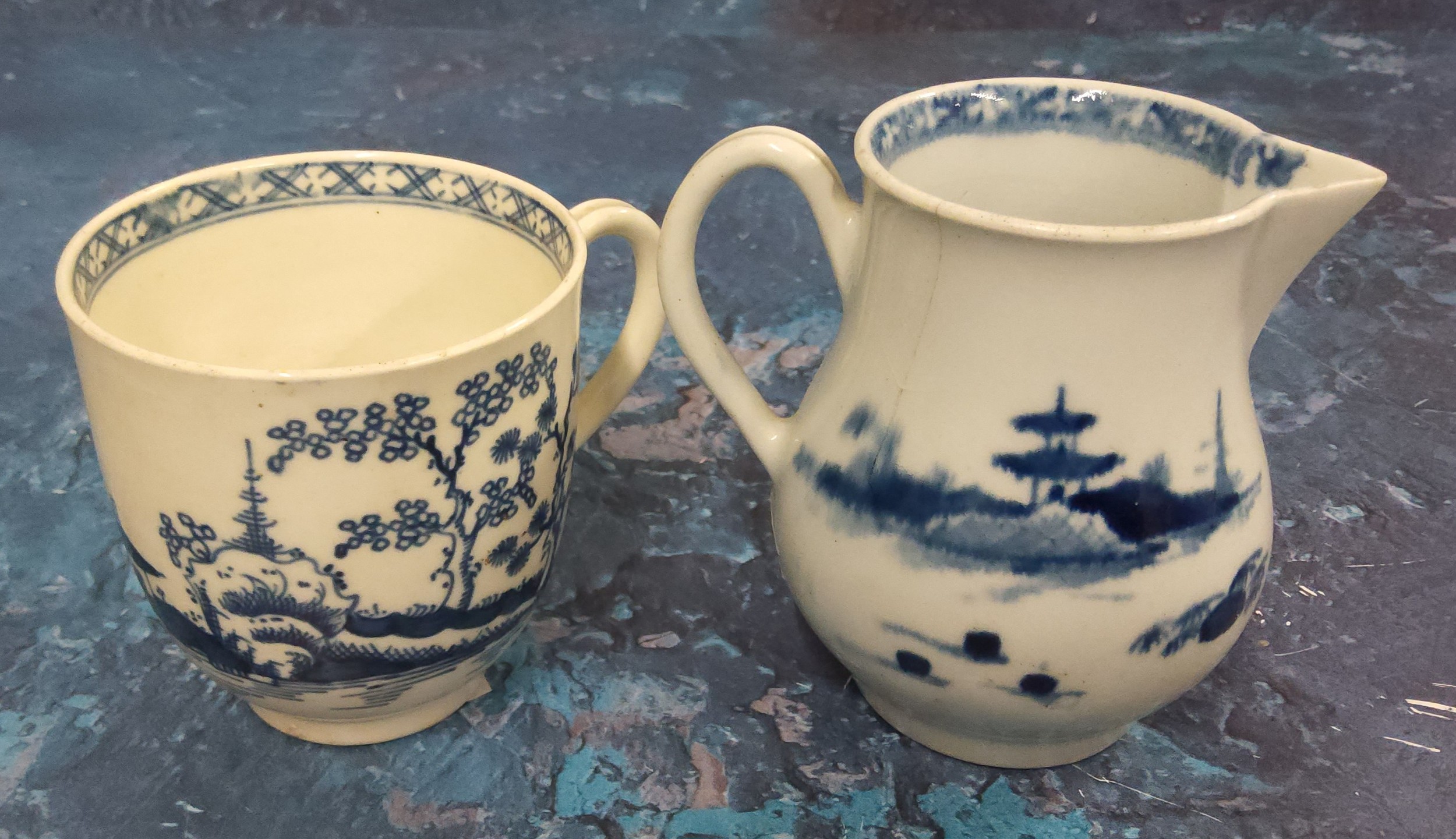 An early Worcester Cannonball pattern  sparrowbeak jug, painted with pine trees, hut and rock