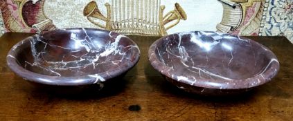 An impressive pair of rouge marble bowls,  well figured veins. 26cm diameter