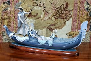 A large Lladro figural group 'In The Gondola' modelled by Francisco Catala with gondolier and