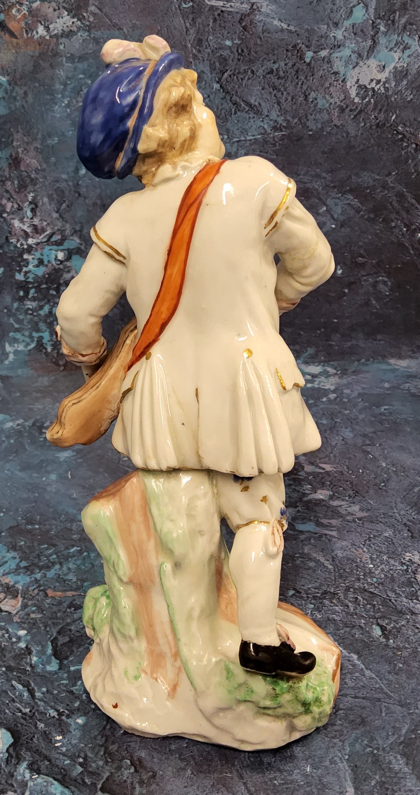 A Bristol Hurdy Gurdy figure, moulded by John Toulouse,  standing leaning on a stump, picked out - Image 2 of 3