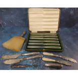 A set of six silver hafted dessert knives, Sheffield 1812,butter knife, cased; an Edwardian silver