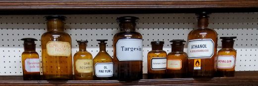A collection of nine early 20th century apothecary bottles