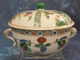 A Chinese famille verte two-handled circular bowl and cover, painted with buds and foliage, the