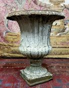 A Victorian cast iron Campana shaped urn, distressed white paint, plinth base