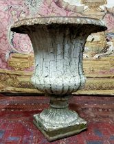 A Victorian cast iron Campana shaped urn, distressed white paint, plinth base