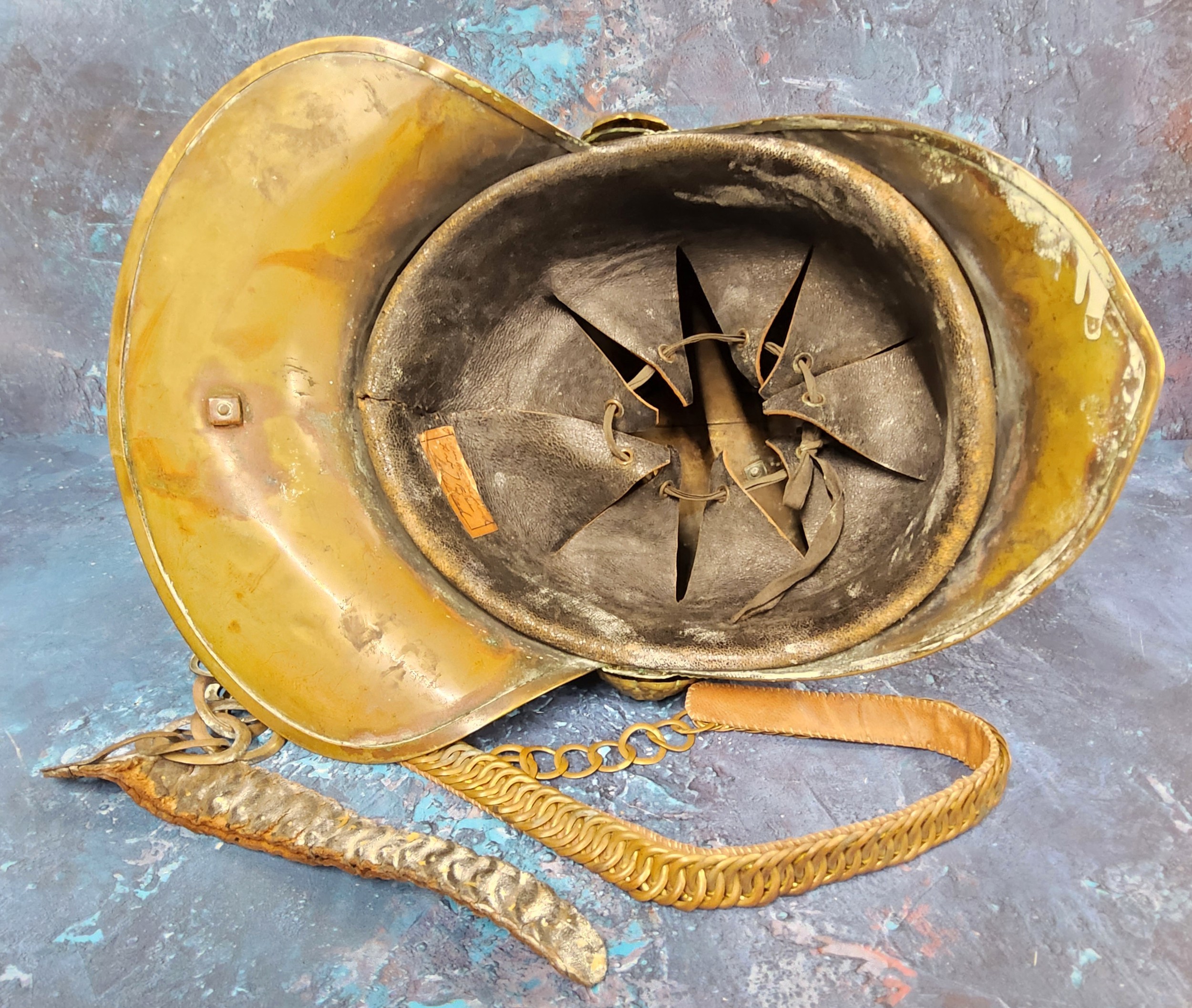 A Victorian brass Merryweather fireman's helmet, ornate high comb, applied with emblem, leather - Image 3 of 3