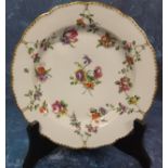 A Bristol shaped circular plate,  painted with chains of flowers, a central floral bouquet, gilt