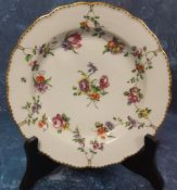A Bristol shaped circular plate,  painted with chains of flowers, a central floral bouquet, gilt