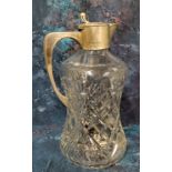 A silver mounted claret jug, of waisted cylindrical form, slice cut, hinged cover, 25cm high,