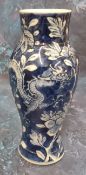 A Chinese vase, decorated in underglaze blue with scrolling dragons and peonies, 15.5cm high, four