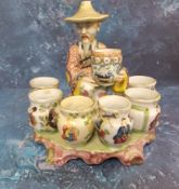 A Chinese figural tulip/bulb vase, with kneeling chinaman holding a vase within six further vases,