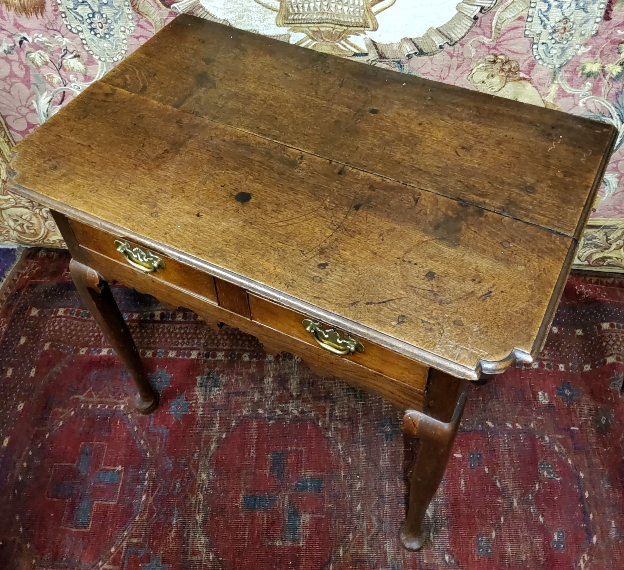 A George III oak lowboy or side table, oversailing shaped rectangular top with moulded edge above - Image 2 of 2