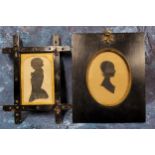 A Victorian cut-card silhouette, of a lady, head and shoulders, oval, 10cm x 7.5cm, ebonised frame;