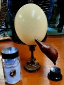 Natural History - an ostrich egg on turned olive wood plinth stand; a mounted seed pod and clamp wet