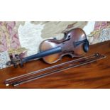 A late 19th century violin, two piece back,  stamped Stainer,  length 37cm long, c.1890;  two bows